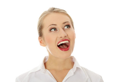 Portrait of young woman against white background