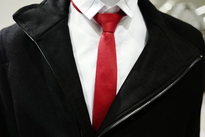 Close-up of man with red umbrella