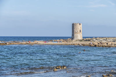 The beach of la caletta, with an ancient tower