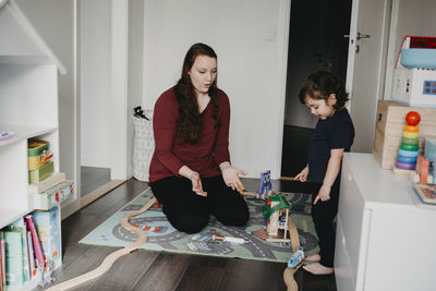 Women sitting on table at home