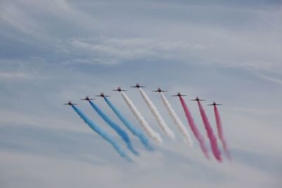 Low angle view of airshow in sky