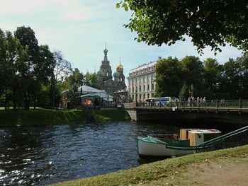 Bridge over river with buildings in background