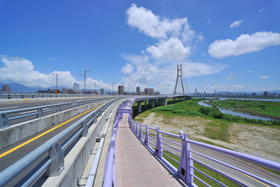 Bridge over road against sky