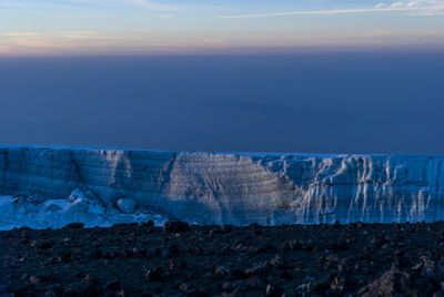 Scenic view of land against sky during winter