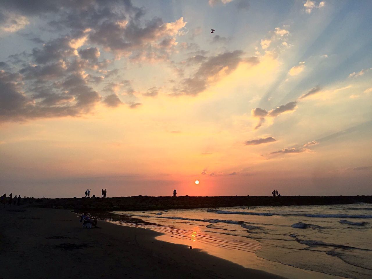 SCENIC VIEW OF BEACH DURING SUNSET