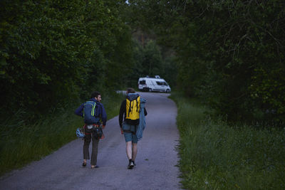 Rock climbers walking in forest