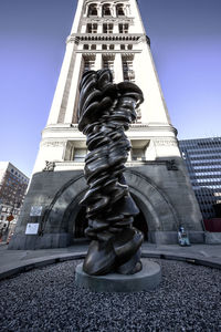 Low angle view of statue against building