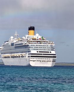 Ship sailing in sea against sky