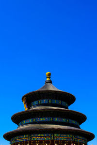 Low angle view of temple against blue sky