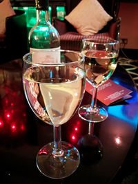 Close-up of wine glasses on table in restaurant