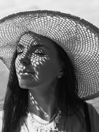 Close-up of woman wearing hat