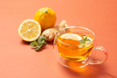 Close-up of orange juice in glass on table