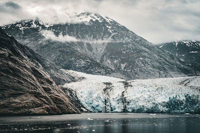 Scenic view of snowcapped mountains against sky at the dawes glacier in alaska 