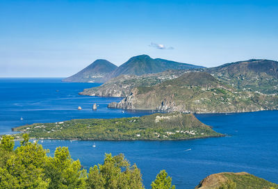 Scenic view of sea against clear blue sky