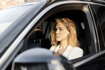 Portrait of woman in car