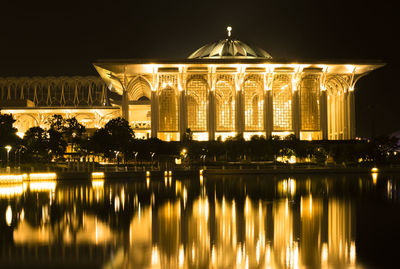 Reflection of iron mosquee in water at night
