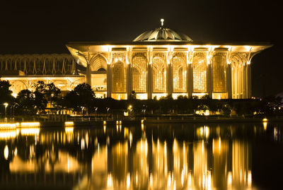 Reflection of iron mosquee in water at night