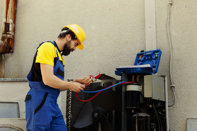 Side view of man working in workshop