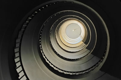 Low angle view of spiral staircase in building