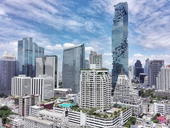 Modern buildings in city against sky