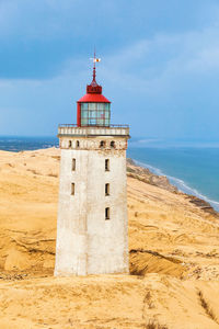 Rabjerg mile a lighthouse on the danish coast in a sand dune