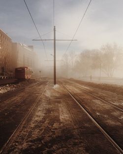 View of railroad tracks against sky during winter