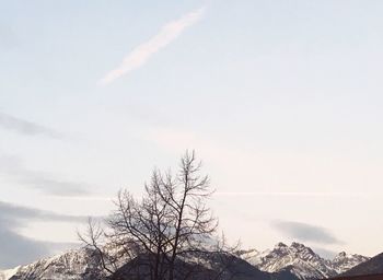 Low angle view of snow covered mountain against sky