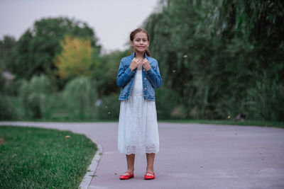 Portrait of smiling young woman standing outdoors