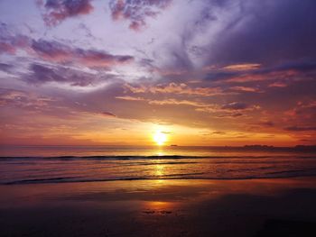 Scenic view of sea against romantic sky at sunset