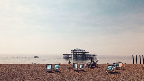 Scenic view of sea and pier against sky