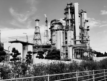 Low angle view of factory against sky