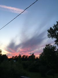 Silhouette trees against sky during sunset