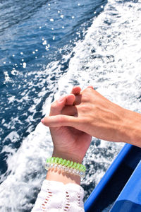 Our hands over sea