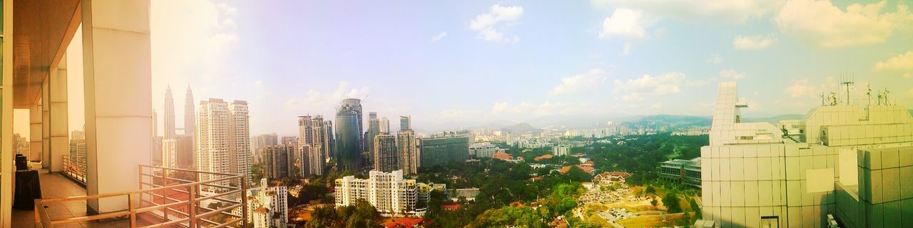 building exterior, architecture, built structure, city, skyscraper, tall - high, cityscape, tower, sky, office building, modern, cloud - sky, crowded, building, capital cities, development, urban skyline, city life, residential building, no people