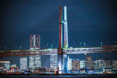 View of suspension bridge at night