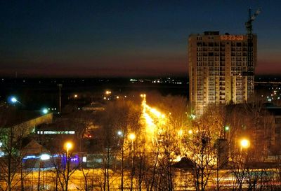 Illuminated buildings in city at night