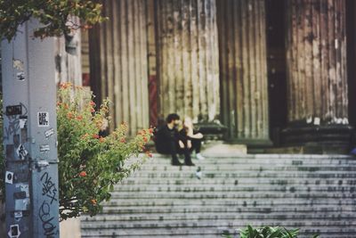Woman standing against wall