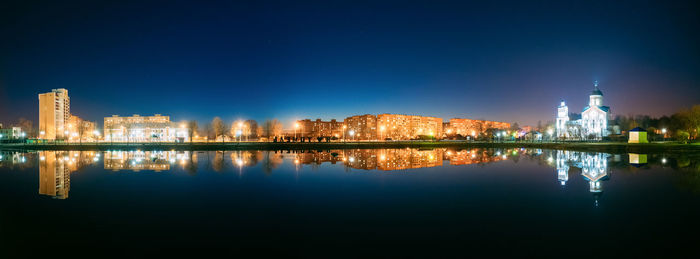 Reflection of city in water at night