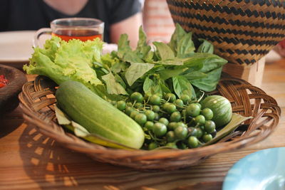 Close-up of salad in a rattan bowl on table