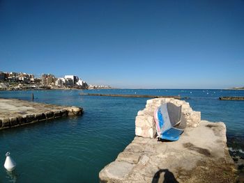 Scenic view of sea against clear blue sky