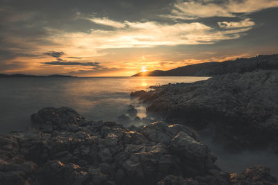 Scenic view of sea against sky during sunset