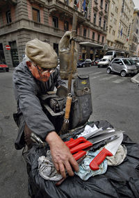 High angle view of knife grinder on street in city