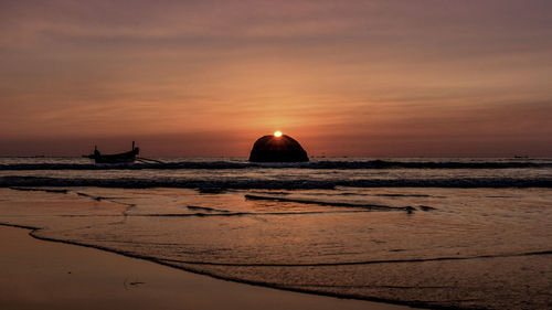 Scenic view of sea at sunset