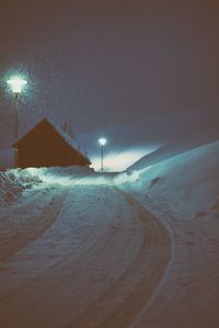 Scenic view of beach against clear sky at night