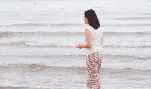 Woman standing at beach