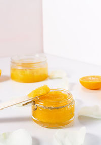 Homemade cosmetic scrub for peeling and cleansing the skin of the body in a glass package 