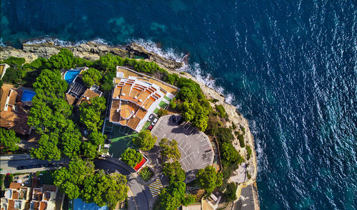 High angle view of swimming pool by buildings in city