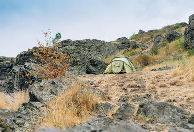 Tent on the mountain background. local tourism, weekend trip