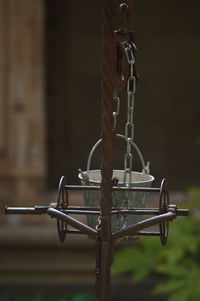 Close-up of bucket hanging on pulley