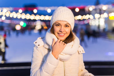 Portrait of smiling young woman during winter